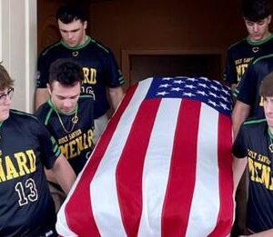 High school seniors carry the casket of Air Force veteran with no family