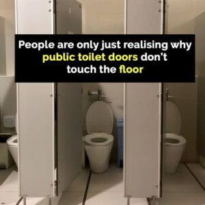 The reason doors in public bathrooms don’t touch the ground